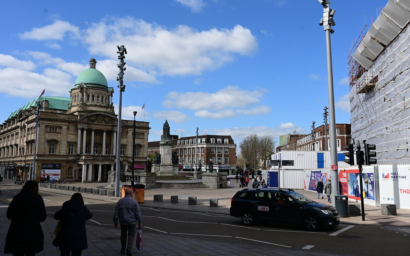 Queen Victoria Square in Hull, with the Maritime Museum building and city-centre streets